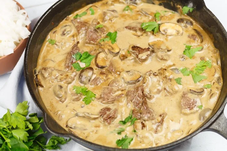 Delicious Beef Stroganoff served with pasta and garnished with parsley