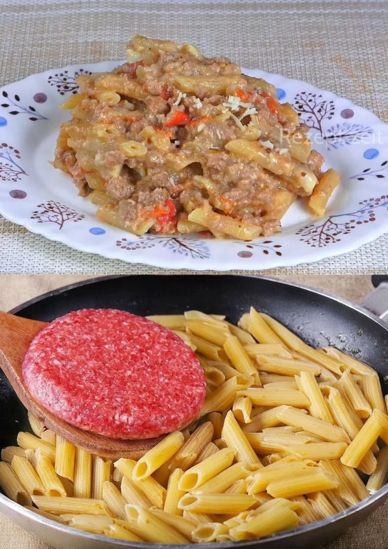Romige pasta met gekruid gehakt en tomatensaus op een bord