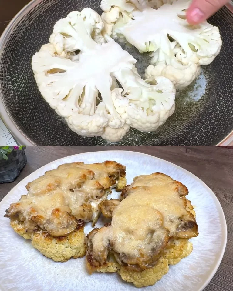 Bloemkoolsteaks met champignon tijm vulling en parmezaan op een bord.