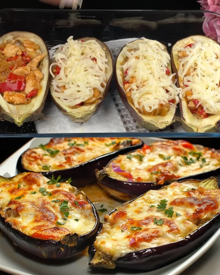 Gevulde aubergines met kip, champignons en kaas op een bord