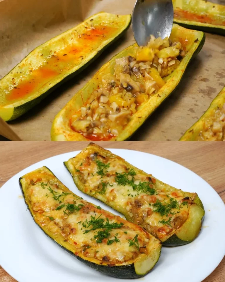 Gevulde courgette met champignons en sinaasappel op een bord.