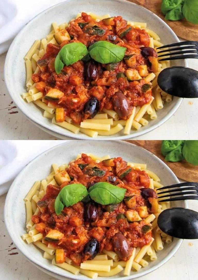 Een bord Pasta Puttanesca met groenten, een smakelijk Italiaans gerecht
