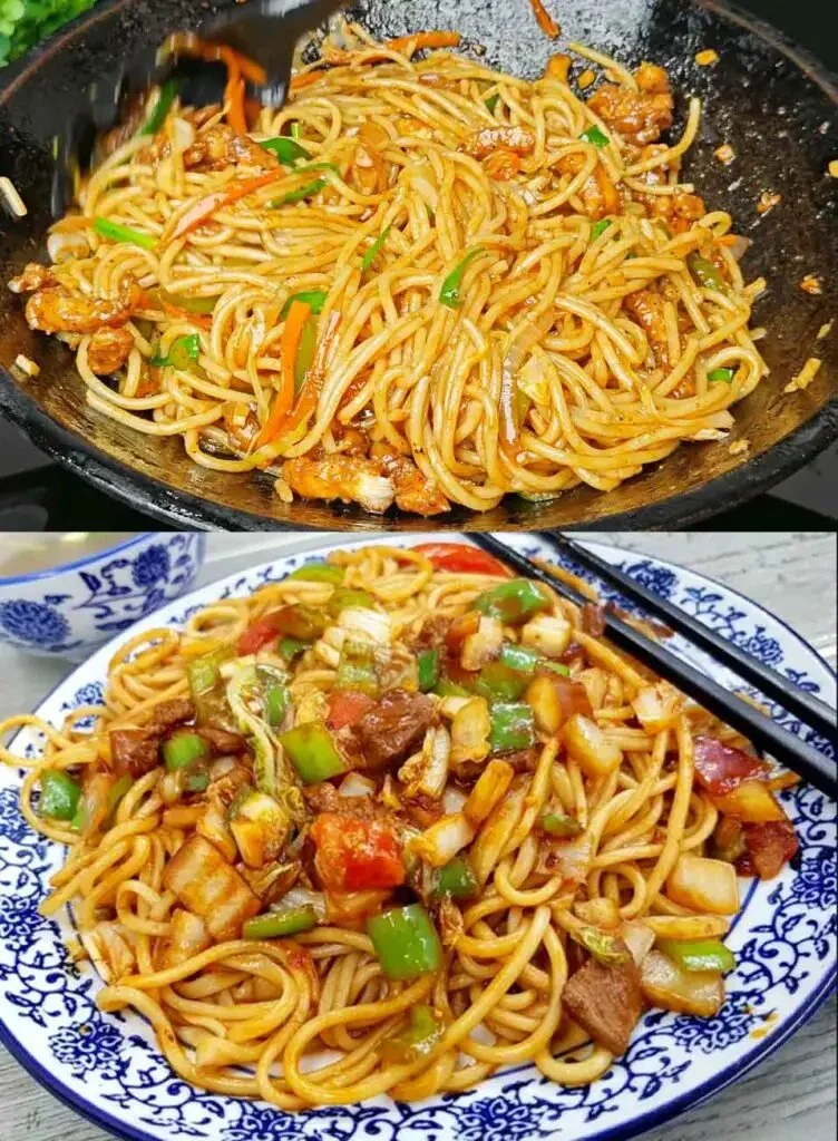 Heerlijke woknoedels met kip en groenten op een bord