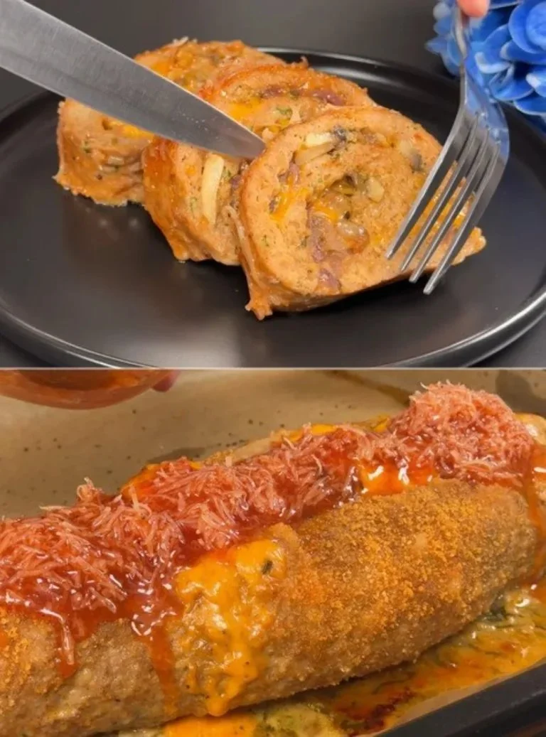 Gehaktbrood met een smaakvolle twist, geserveerd met groenten en kruiden.
