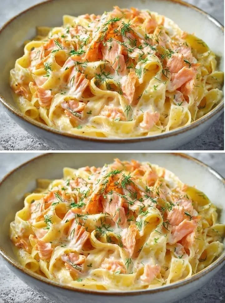 Romige pasta met roomkaas en gerookte zalm op een bord